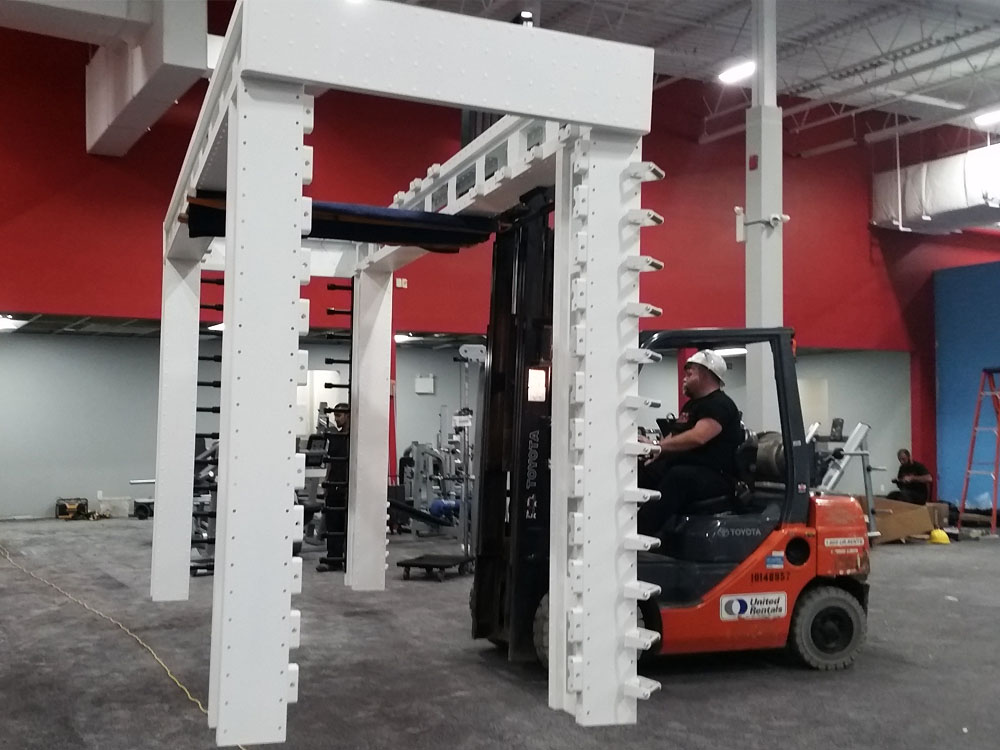 Forklift erecting multi-purpose commercial fitness equipment