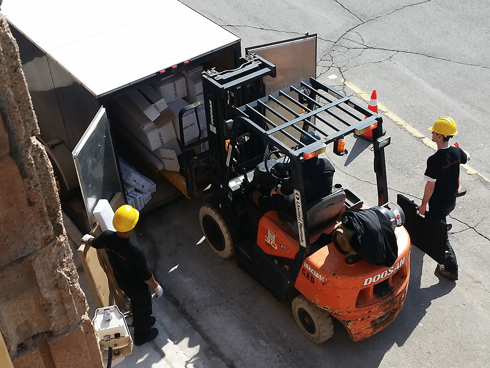 Staff delivering commercial fitness equipment